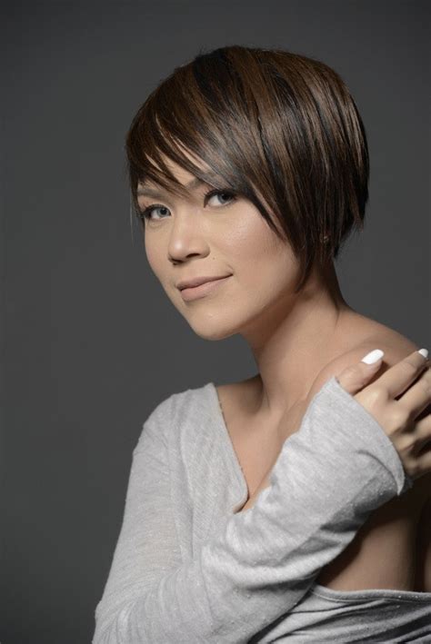 Young Filipina singer/songwriter holds her head high despite hair .